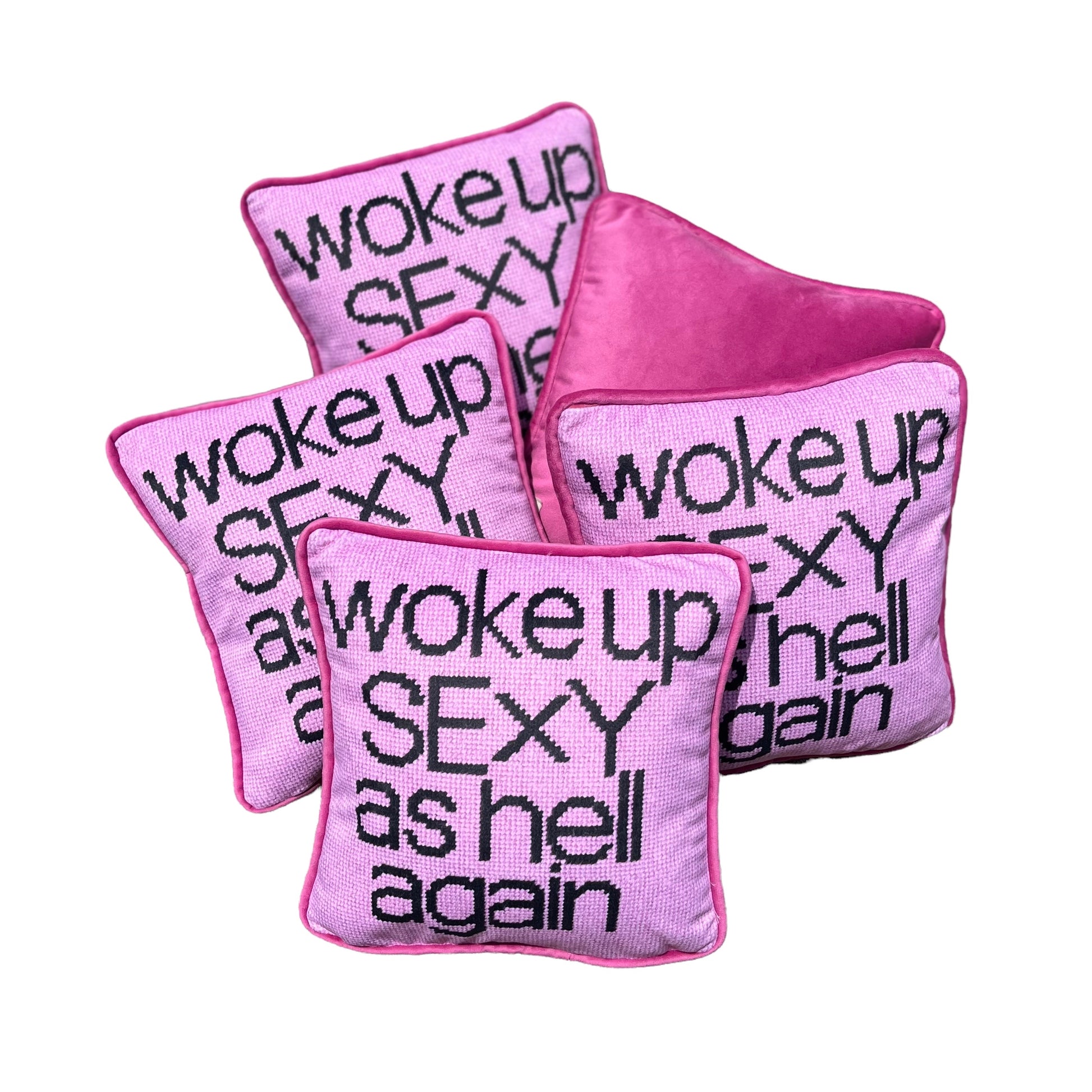 pink velvet with black script reading WOKE UP SEXY AS HELL AGAIN on full face of pillow