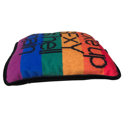 black text with woke up sexy as hell again centered on pillow on rainbow flag background