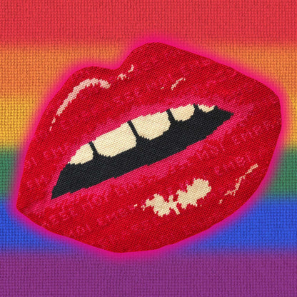 rainbow velvet pillow with large lips highlighted in neon pink