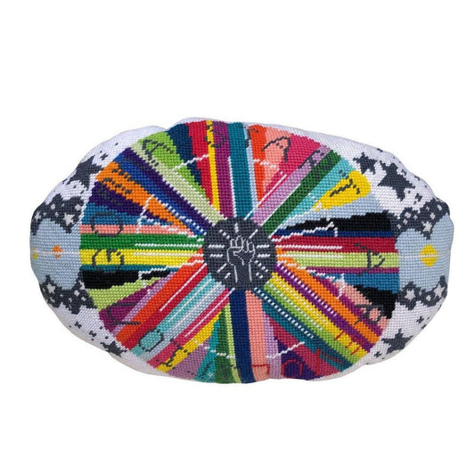 pillow center is dark gray with white fist pump, rainbow circle radiates out with GONNA START A REVOLUTION, cloud and stars border