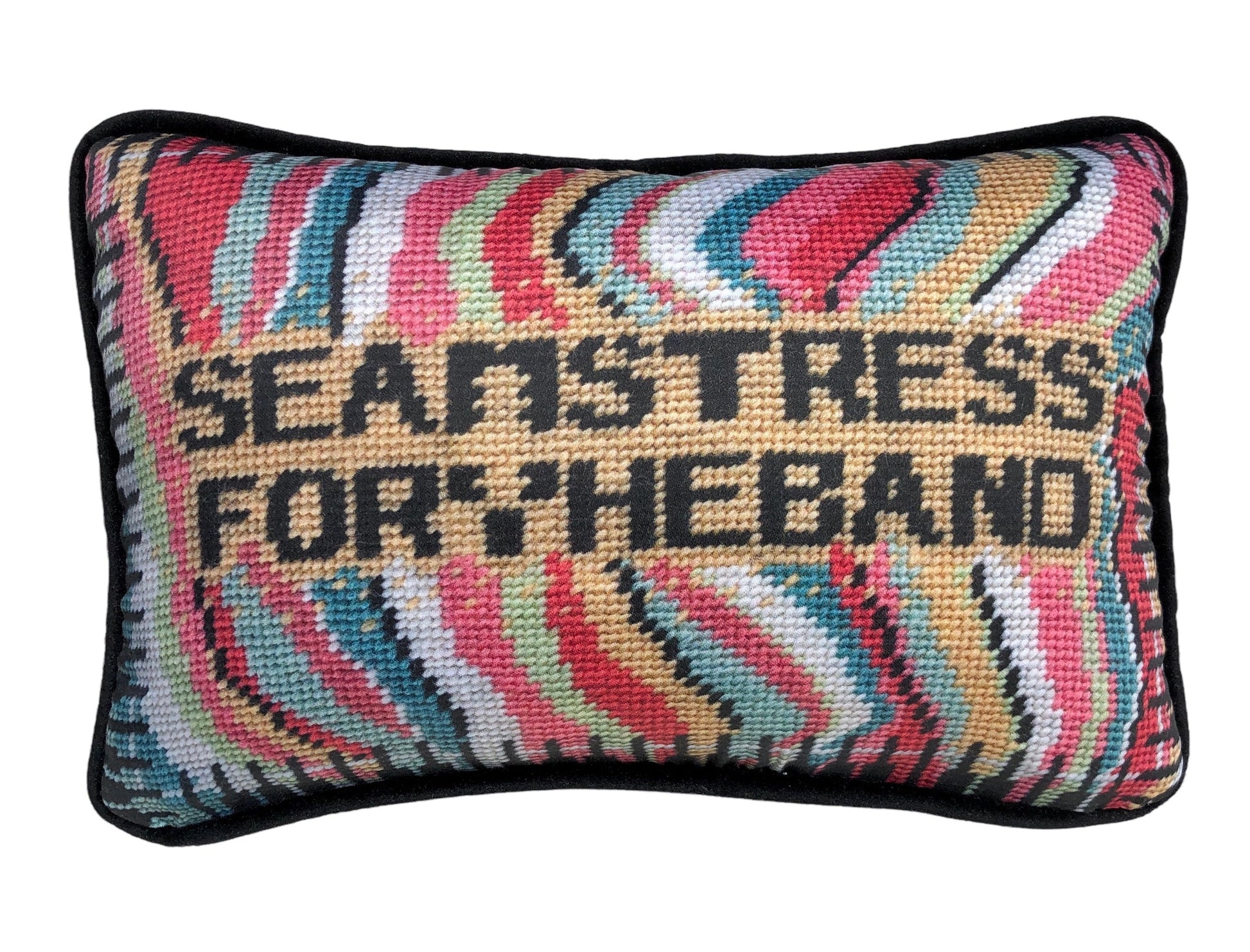 SEAMSTRESS FOR THE BAND black letters inside tan box, surrounded by wavy bands of turquoise, pink, red, white, lime and a keyboard border