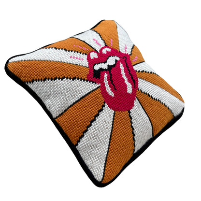 the rolling stones tongue with pink highlights on a gold and white fanned out background