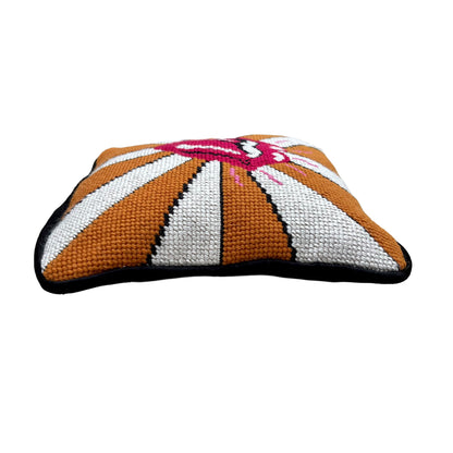 the rolling stones tongue with pink highlights on a gold and white fanned out background